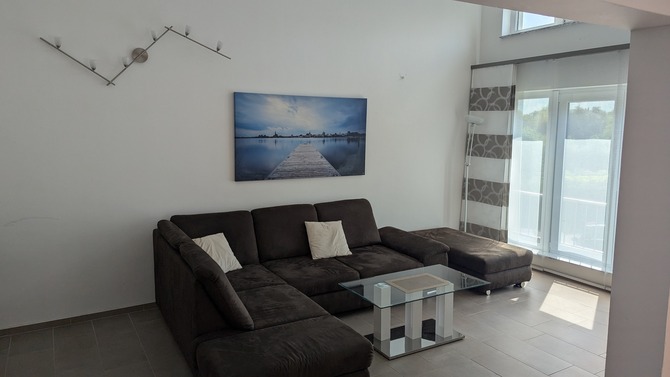 Ferienwohnung in Börgerende - Appartement 3 - Sunshine - Wohnzimmer mit Doppelbettcouch