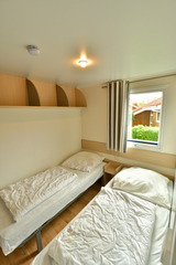Ferienhaus in Pelzerhaken - Mobilheim  Pacifique - Schlafzimmer mit Einzelbetten