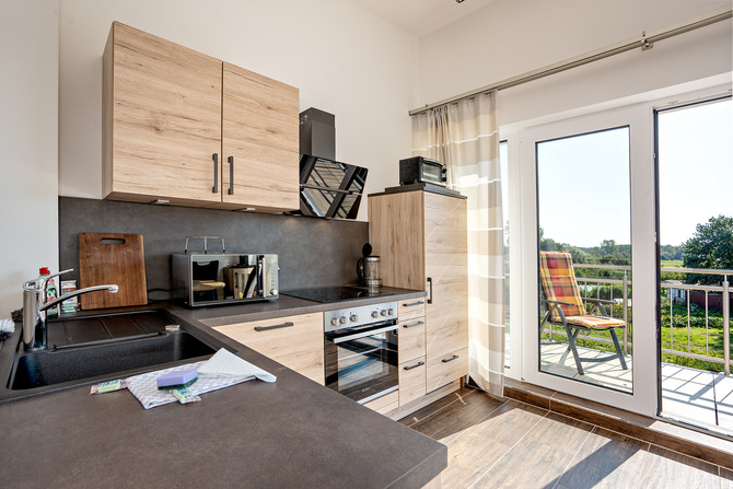Ferienwohnung in Börgerende - Appartement 5 - Traumblick - Küche mit Südbalkon